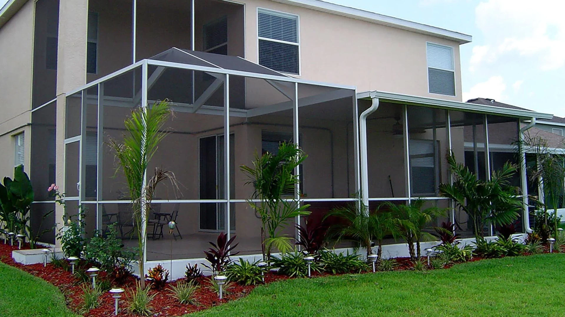 A two-story screen room installed at a home in Wimauma, FL.