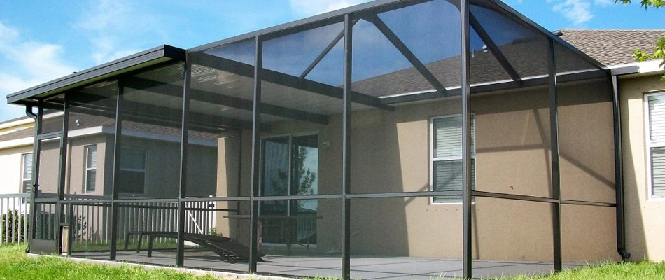 Screen sun room installed over a property in Brandon, FL.